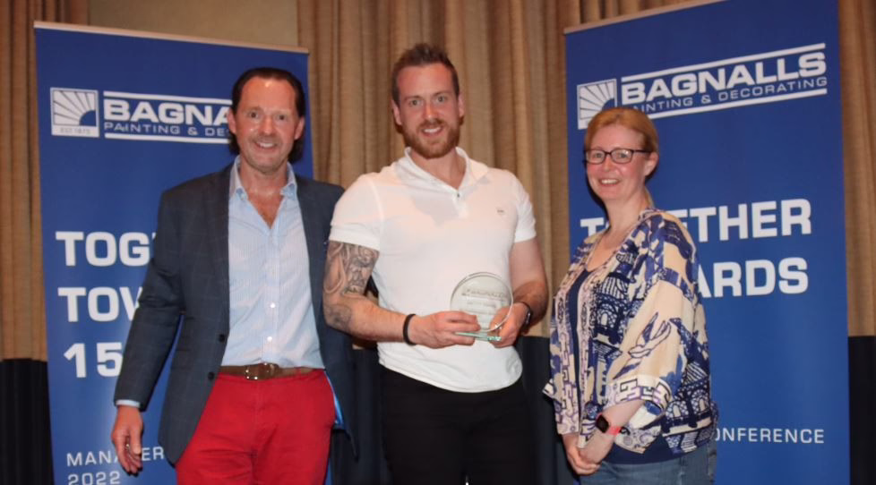 Stephen Bagnall And Becky Slater Presenting A Bagnalls Team Member With An Award