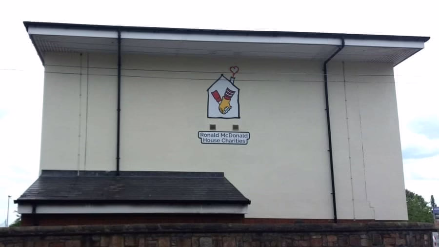 A Building With The Ronald McDonald House Charities Logo Painted On The Wall