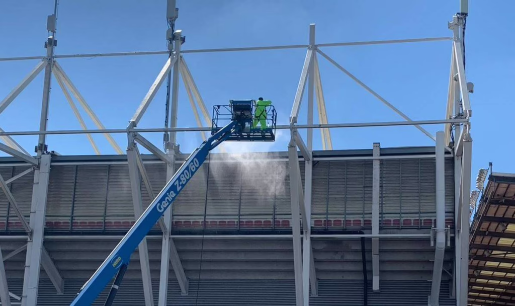 A Bagnalls Team Member In Safety Gear Uses A Mobile Elevating Work Platform To Reach The Top Level Of The Stoke City FC Stadium