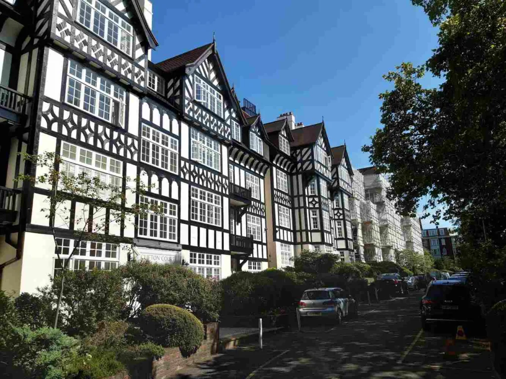 A Street View Of A Building Featuring Tudor-Style Architectural Detailing