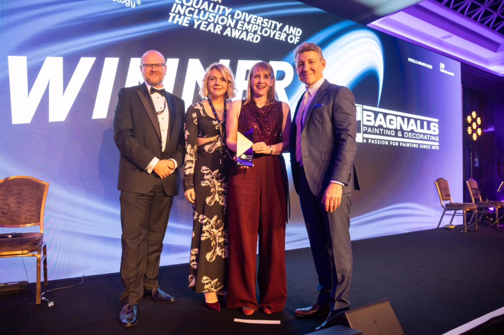 Award ceremony with four presenters.